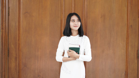 Christian women pray and hold the Scriptures