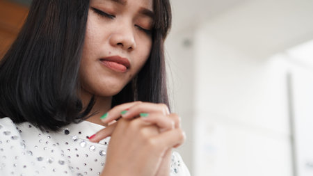 a Christian woman praying humbly in church