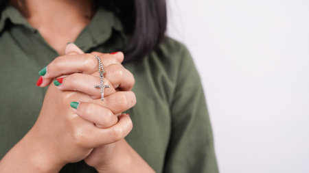 a Christian woman praying humbly isolated white background