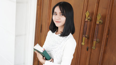 Christian women pray and hold the Scriptures
