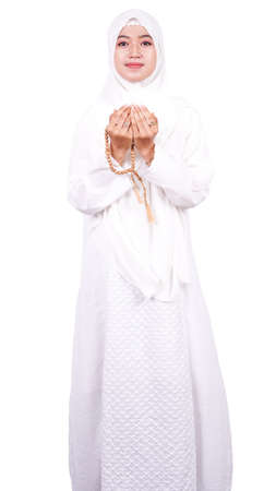 Asian Muslim woman pray isolated white backgroundの写真素材