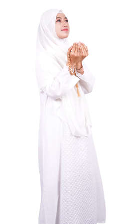 Asian Muslim woman pray isolated white backgroundの写真素材