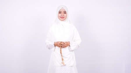 Asian women muslim pray on a white backgroundの写真素材