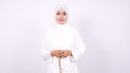 Asian women muslim pray on a white backgroundの写真素材