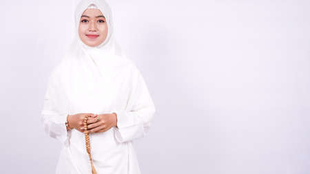 Asian women muslim pray on a white backgroundの写真素材