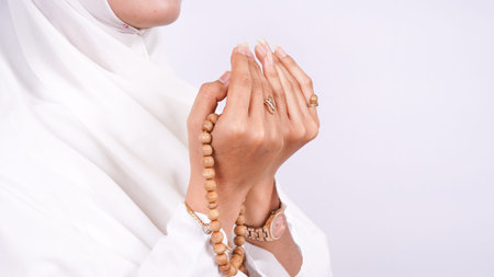 Asian Muslim woman pray isolated white background