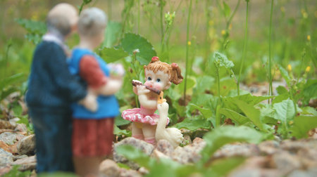 Ballerina plays flute for her grandparents. Resin miniatures.の写真素材