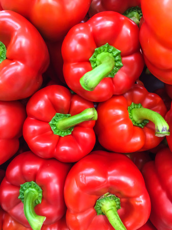 Red capsicum tops close up whole in the margetの写真素材