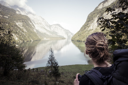 woman enjoying the view over Königsseeの写真素材