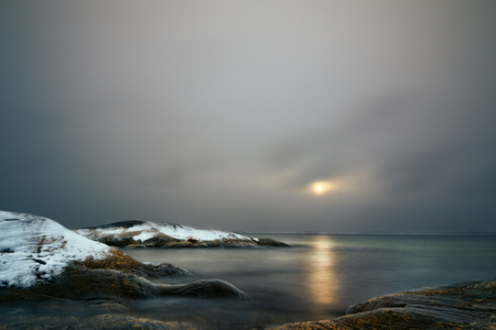 Sunset on a cold winters day at the baltic seaの写真素材