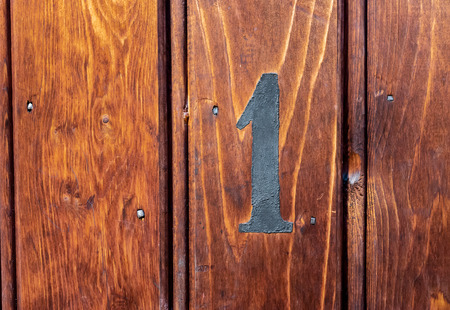 number 9 on door of storage room for tenants in century-old apartment building in stockholmの写真素材