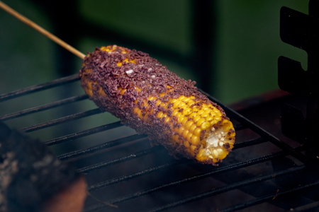 barbecue corn on the cob with spicesの写真素材