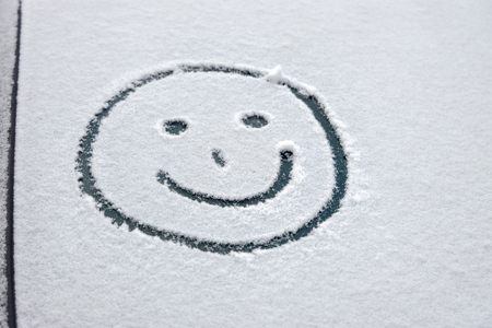 windscreen of car with graffiti in snowの写真素材