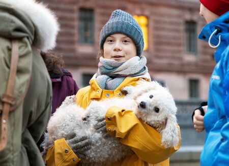 Stockholm, Sweden. 20 December, 2019. 16-year-old Swedish climate activist Greta Thunberg back in Sweden demonstrating on Mynttotget in Stockholm on Fridays. With "protester poodle"のeditorial素材