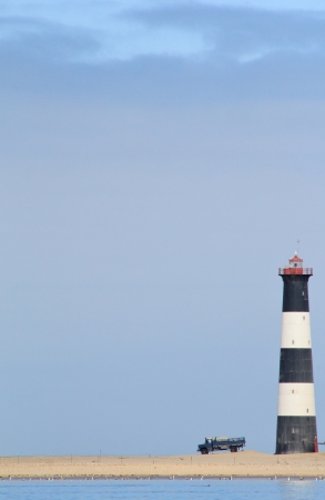 Art of Nature and Industry - Abstract portrait of an old truck, ligthouse and and Atlantic Oceanの写真素材