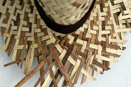 holiday background with straw hat textureの写真素材