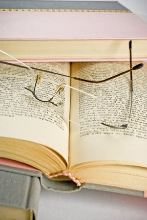 Glasses on booksの写真素材