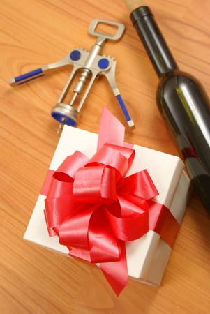 Red wine glass, gift box and openerの写真素材
