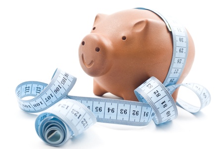 Brown piggy bank isolated on white の写真素材