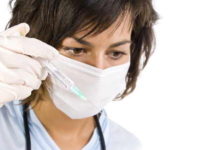Young nurse in mask with syringe の写真素材