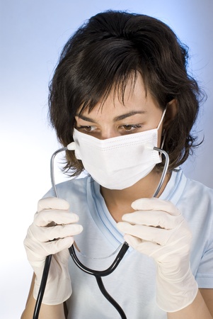 Doctor with stethoscope. Isolated over white background の写真素材