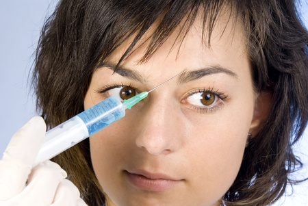 Beautiful woman recieving a botox injectionの写真素材