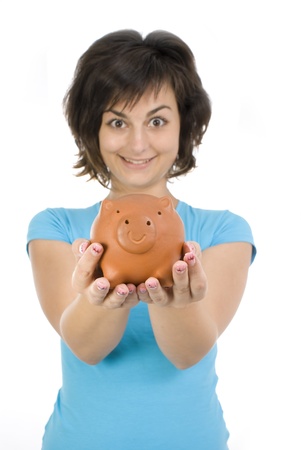 Proud girl holding piggy bank full of savings の写真素材