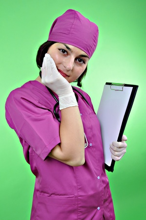 Attractive lady doctor smiling isolated on whiteの写真素材