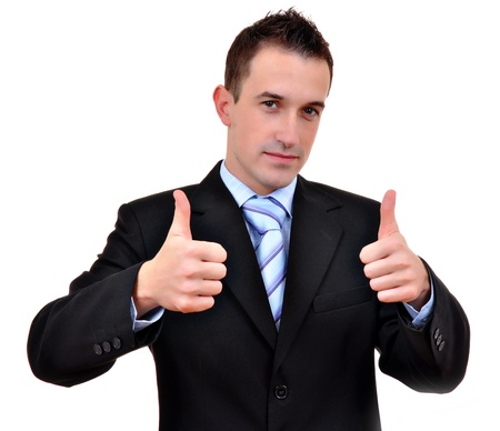 Young happy business man going thumbs up, isolated on white の写真素材