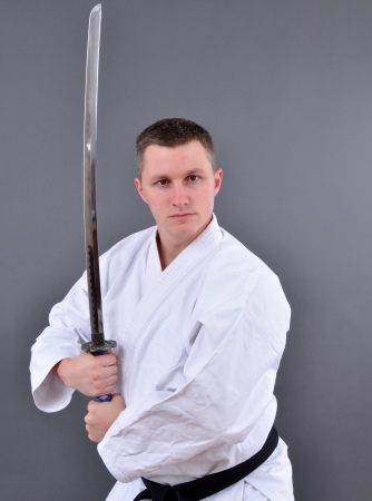 Karate man with single edged Japanese swordの写真素材
