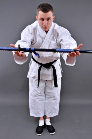 Karate man giveing a  Japanese swordの写真素材