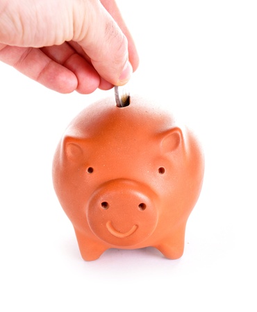 Brown piggy bank isolated on white の写真素材