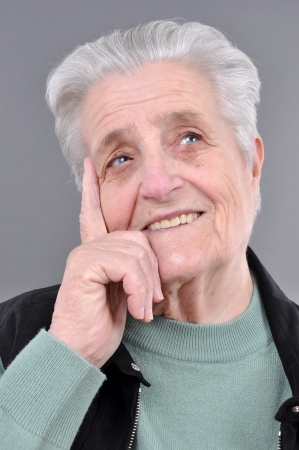 Old, attractive Caucasian woman thinkingの写真素材