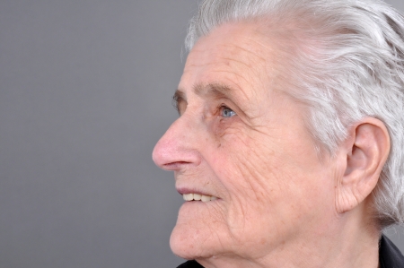 Old, attractive Caucasian woman looking off into the distance  の写真素材