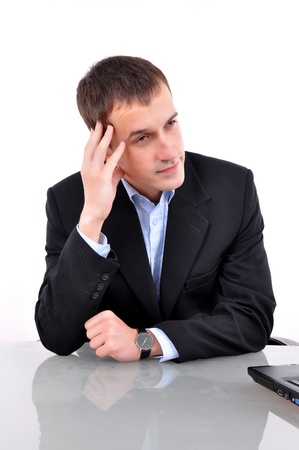 A young business man thinking の写真素材