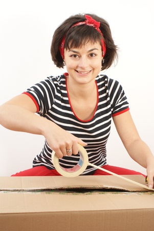 A pretty woman working with moving and shipping boxes の写真素材