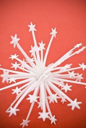 Snowflake on red backgroundの写真素材