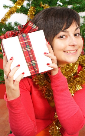 smiling girl with gift box の写真素材