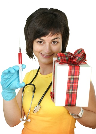 medical doctor with syringe and gift box on white background の写真素材