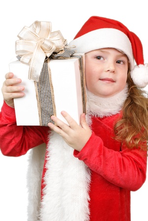 Girl in christmas hat with gift の写真素材
