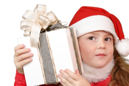 Girl in christmas hat with gift の写真素材
