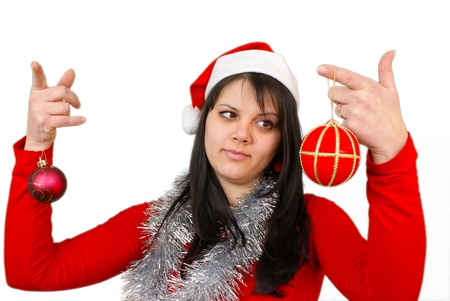 Girl holding two globes and thinking, isolated on white background  の写真素材