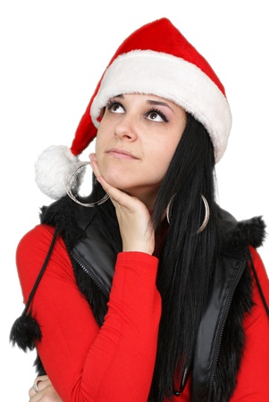 beautiful christmas girl thinking and smiling - isolated over a white backgroundの写真素材