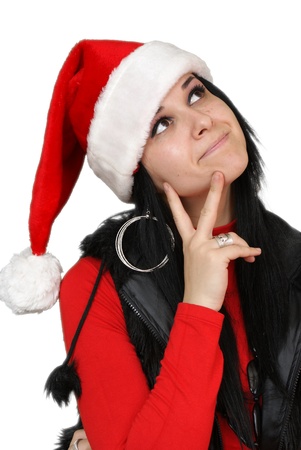 beautiful christmas girl thinking and smiling - isolated over a white backgroundの写真素材