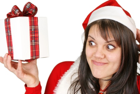 Girl holding a gift, isolated on white background. の写真素材