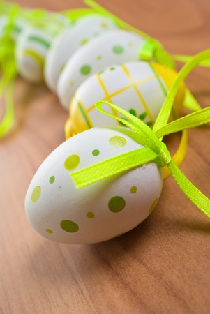 Colorful easter eggs on old wooden background の写真素材
