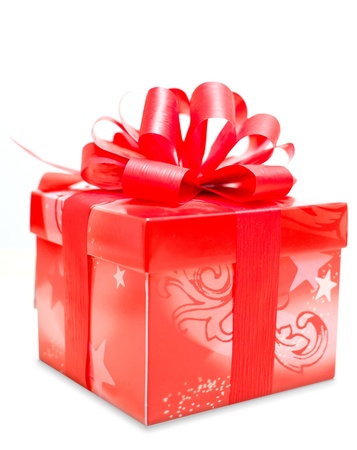 Single red gift box with red ribbon on white background.の写真素材