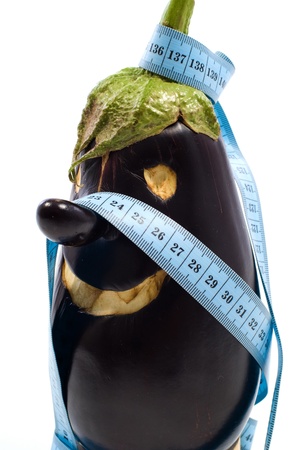 Eggplant nose  with measure tapeの写真素材