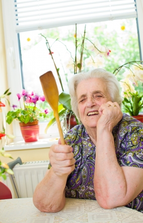 Angry old woman in the kitchebの写真素材
