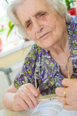 old woman can't read the bookの写真素材